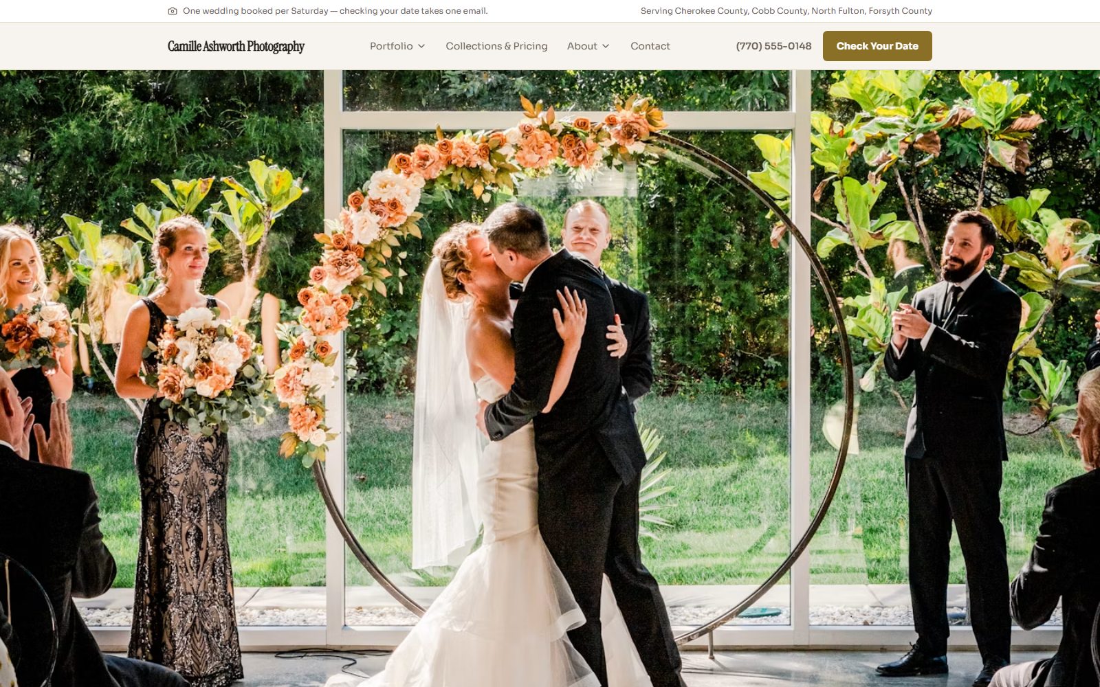 Home page of the Camille Ashworth Photography demo site: a candid first-kiss photo from a real wedding ceremony, and a Check Your Date button.
